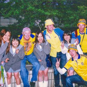 Super cute, always uniformed Japanese schoolgirls flash the ubiquitous peace sign outside Saitama Stadium